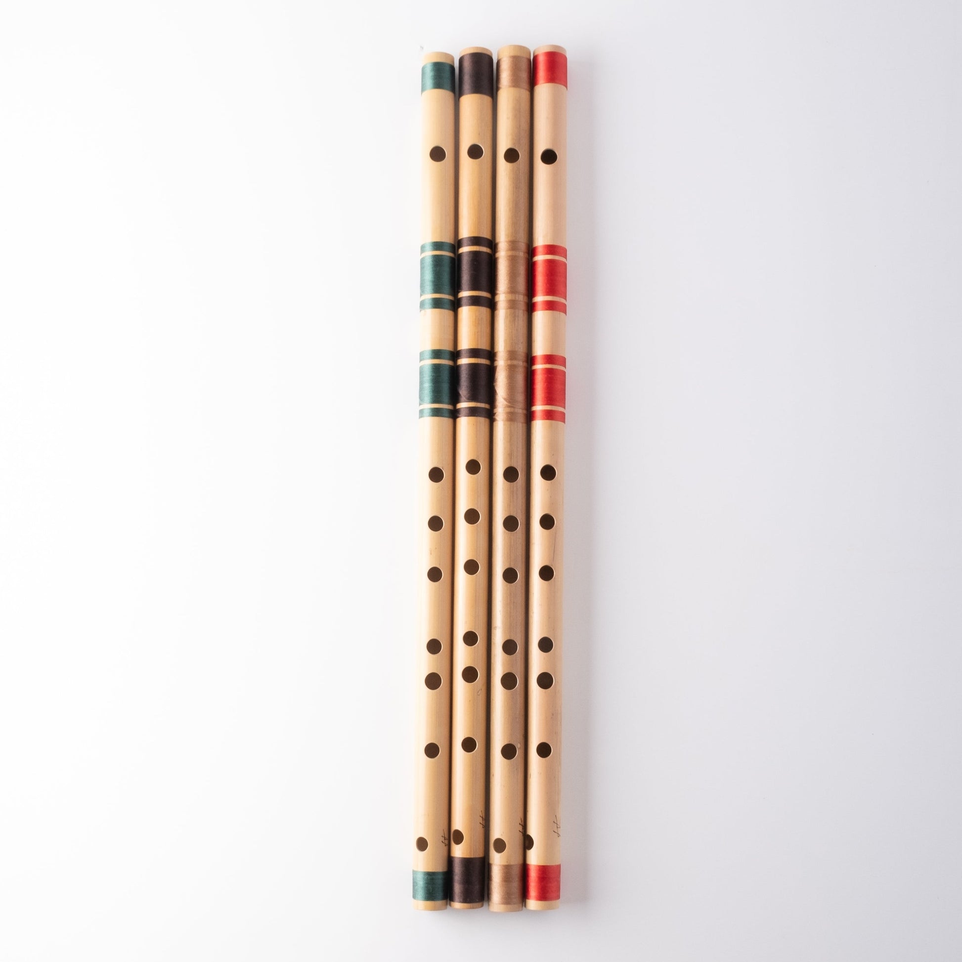 G scale bansuri's in green, brown, gold and red thread color