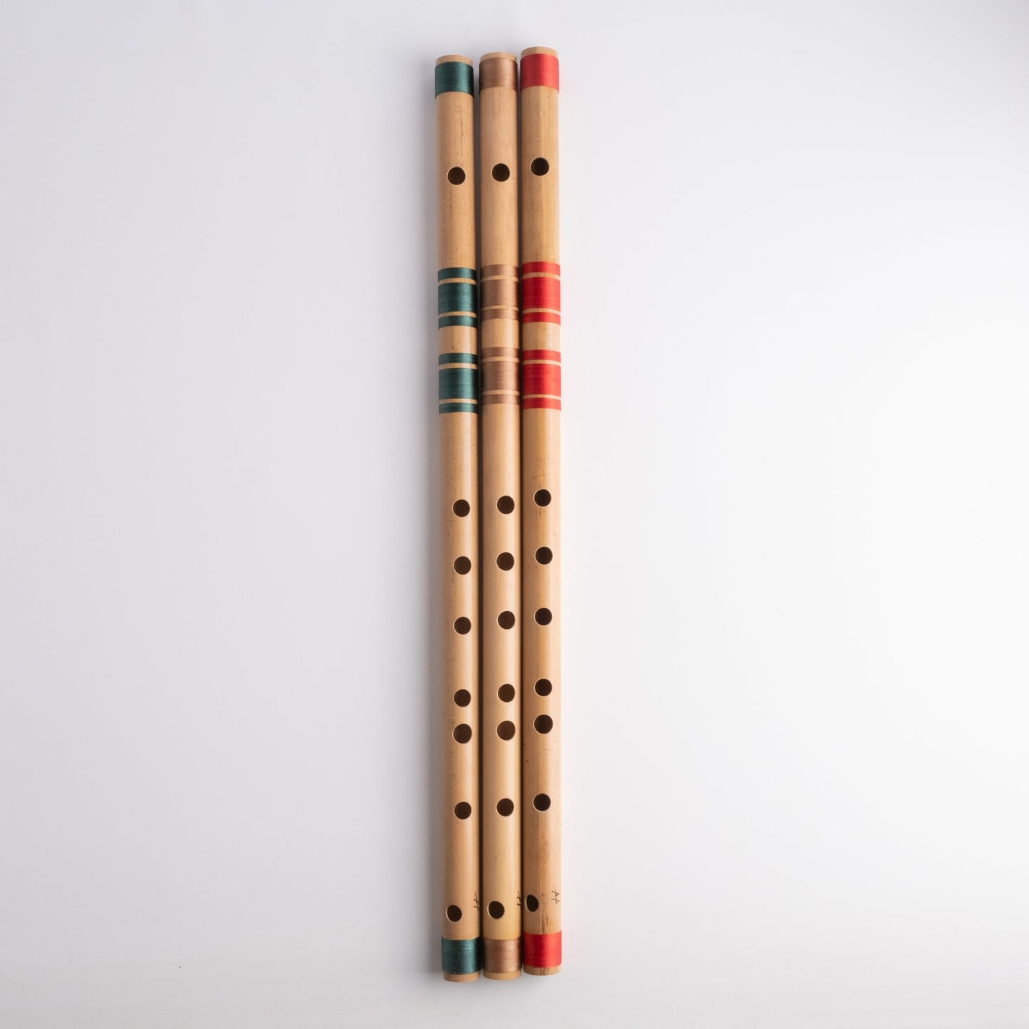 G# scale bansuri's in green, gold and red thread color