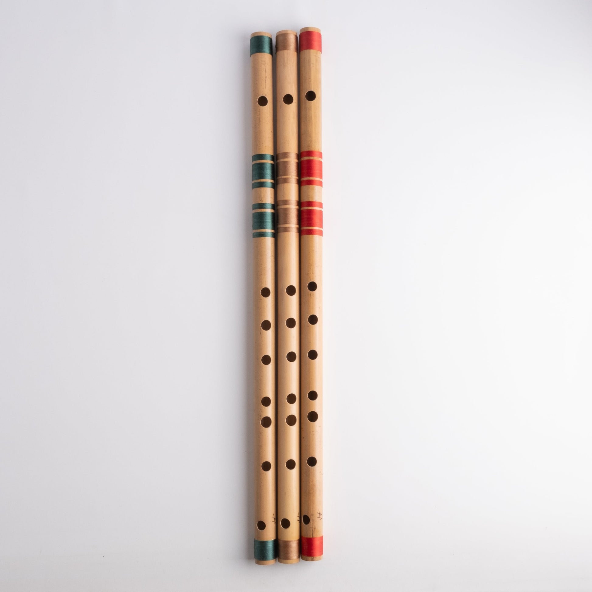 G# scale bansuri's in green, gold and red thread color